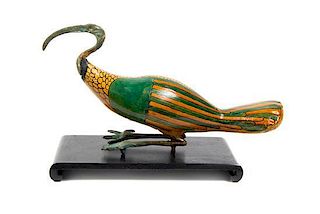 An Egyptian Style Carved, Painted and Metal Mounted Figure, Length 12 inches.