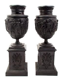 A Pair of Neoclassical Style Cast Metal Urns, Height overall 33 1/2 inches.