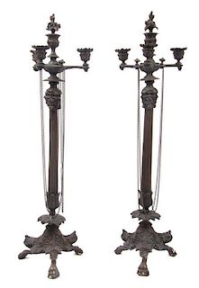 A Pair of Neoclassical Style Cast Metal Three-Light Candelabra, Height 25 3/4 inches.