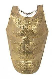 A Decorative Brass Breast Plate, Height of first 21 inches.