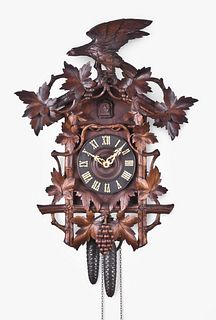 Black Forest hanging cuckoo clock with leaf and vine motif