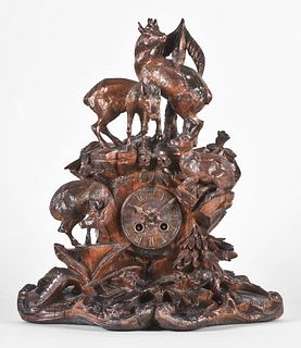 Black Forest mantel clock with hand carved case depicting mountain goats