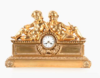 A monumental gilt bronze figural mantel clock in the Louis XVI style signed Robin Her du Roi