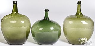 Three olive glass demijohn bottles, 18th c.