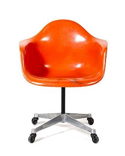 A Charles and Ray Eames Molded Fiberglass Shell Armchair, for Herman Miller, Height 32 x width 24 1/4 x depth 21 inches.