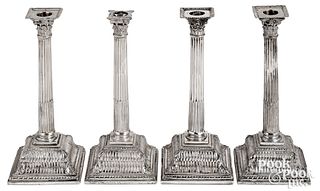 Set of four English weighted silver candlesticks