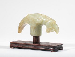 A rare pale green jade carving of a phoenix-form cane handle