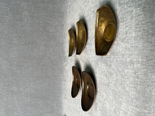 A set of late Qing dynasty brass tea cup holders 
