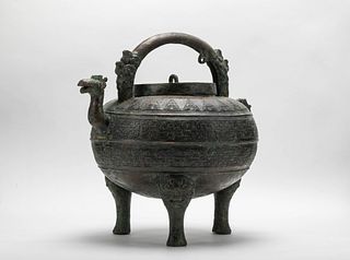An archaic bronze wine vessel and cover (He), Eastern Zhou dynasty