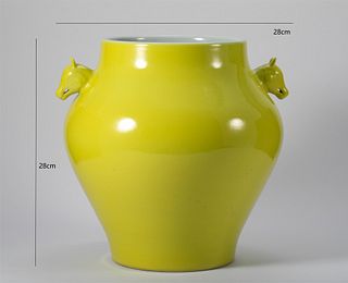 

A RARE YELLOW-GLAZED TWIN-HANDLED JAR