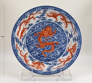AN EXCEPTIONALLY RARE AND LARGE IMPERIAL UNDERGLAZE-BLUE AND IRON-RED ENAMEL 'NINE DRAGON' DISH