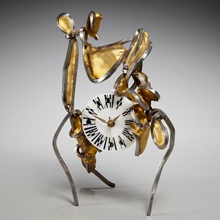 Surrealist gilt metal, steel table clock, signed