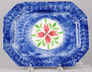 Blue spatter platter with four petal flower