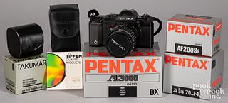 Pentax A3000 35mm camera, with various accessories