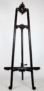 Carved mahogany floor easel