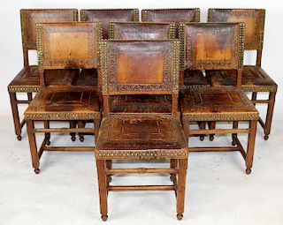 Set of 8 tooled leather dining chairs
