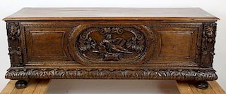 Antique French walnut trunk with relief carving