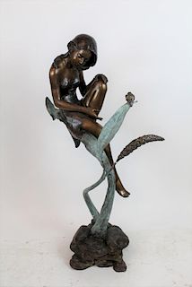Bronze sculpture young girl on leaf with bird