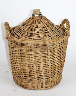 French demi-john bottle in wicker basket