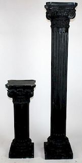 Companion pair of black Corinthian capped columns