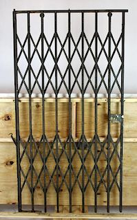 French iron accordion style elevator door