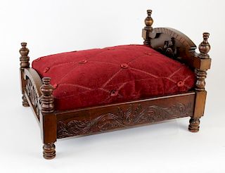 Carved mahogany doll bed