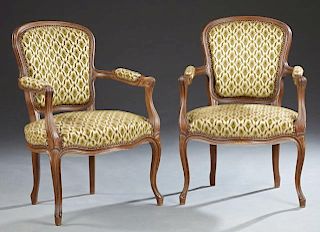 Pair of French Carved Walnut Fauteuils, early 20th