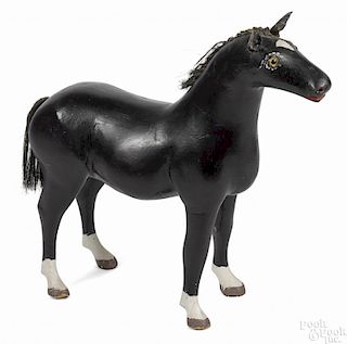 Carved and painted figure of a horse, early 20th c., 23'' h., 23'' w.