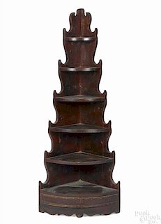 Painted pine corner shelf, early 19th c., with spurred sides and a single drawer in the base
