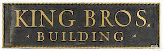Painted pine trade sign for King Bros Building, signed L. Fallon Co. lower middle
