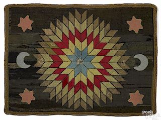 American hooked rug of stars and a moon, ca. 1900, with a braided border, 57'' x 42 1/2''.