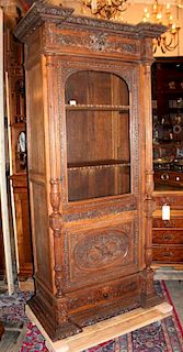 French oak single door bookcase with carved attributes of the arts