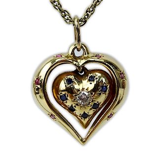 Vintage 14 Karat Yellow Gold Heart Pendant Necklace, the Heart Pendant accented with a Round Brilliant Cut Diamond, Rubies an