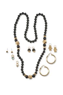 A mixed group of 14k gold and black stone jewelry