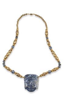 A carved sodalite beaded statement necklace