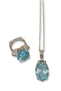 A set of sterling silver and gold blue topaz jewelry