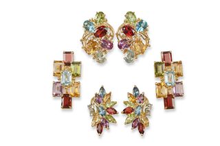 A group of vintage 14k diamond and gemstone cocktail earrings
