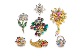 A collection of vintage designer floral brooches