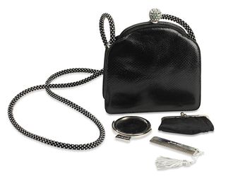 A Judith Lieber black snake leather evening purse