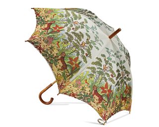 A vintage Gucci jungle motif caned umbrella