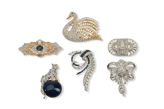 A collection of designer retro-style brooches