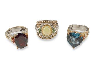 A group of sterling silver and gemstone rings