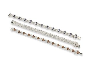 A collection of multi-stone fine link bracelets
