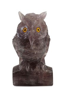 A carved amethyst owl figure