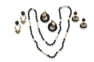 A group of retro-style gold and black jewelry