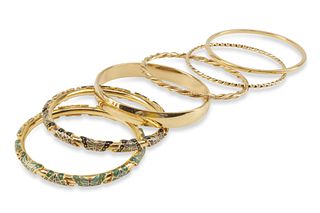 A group of vintage enamel and gold-toned metal bangle bracelets