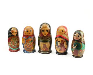 A group of Russian lacquered wood nesting dolls