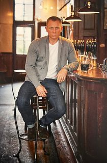 Terry O'Neill, Daniel Craig Posing With A Pint At A North London Pub, 2012