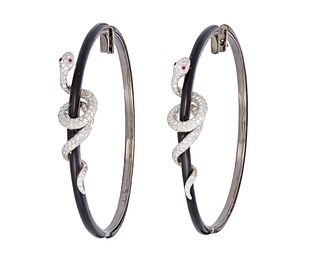 A pair of diamond and enamel snake hoop earrings