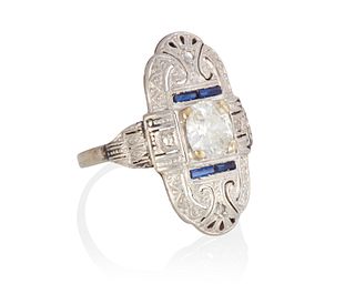 A diamond and sapphire navette ring